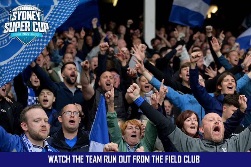 Two people to watch the team run out from the field Club0